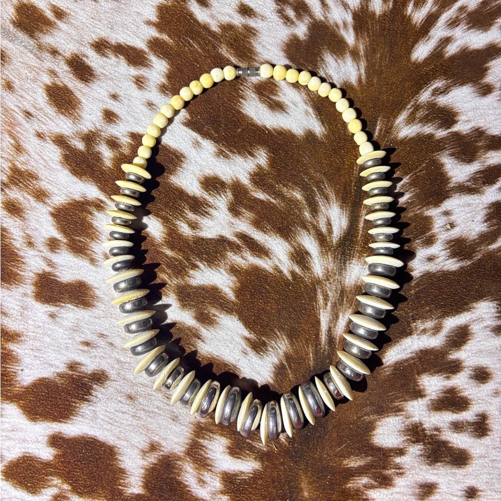 Vintage Carved animal bone and silver disc necklace